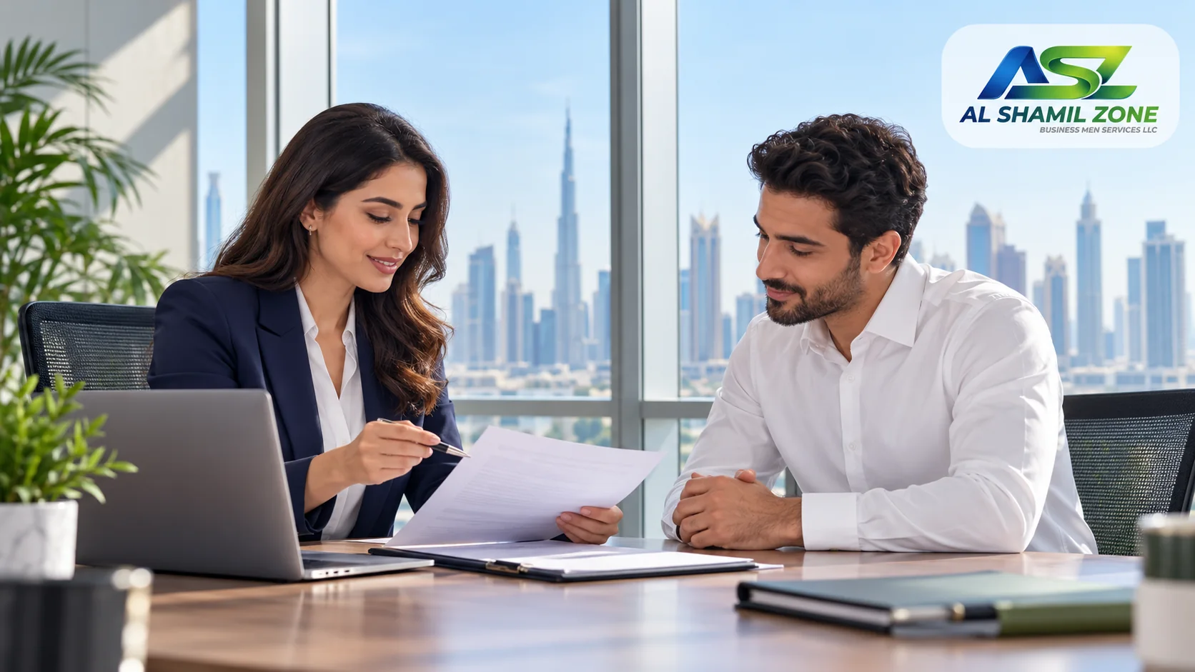 HR representative and employee reviewing exit-process paperwork in a Dubai office, with a small Al Shamil Zone logo in the top-right corner