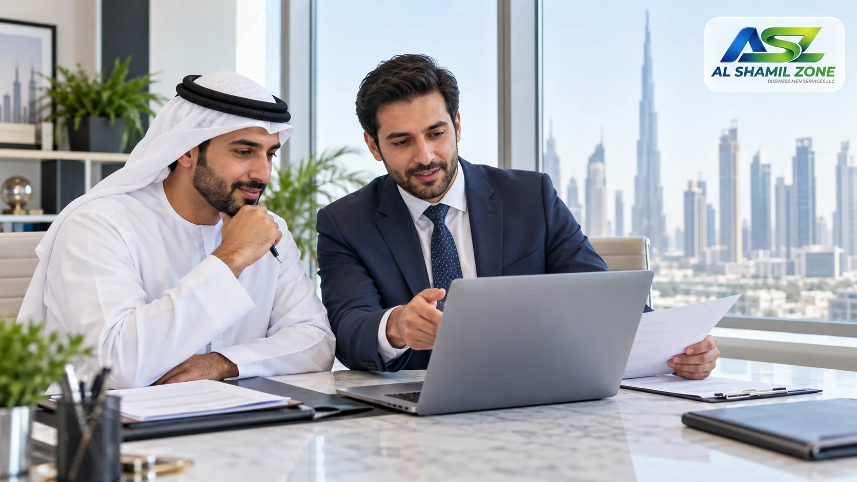 Company owner and adviser reviewing Dubai establishment records with a small Al Shamil Zone logo in the top-right corner